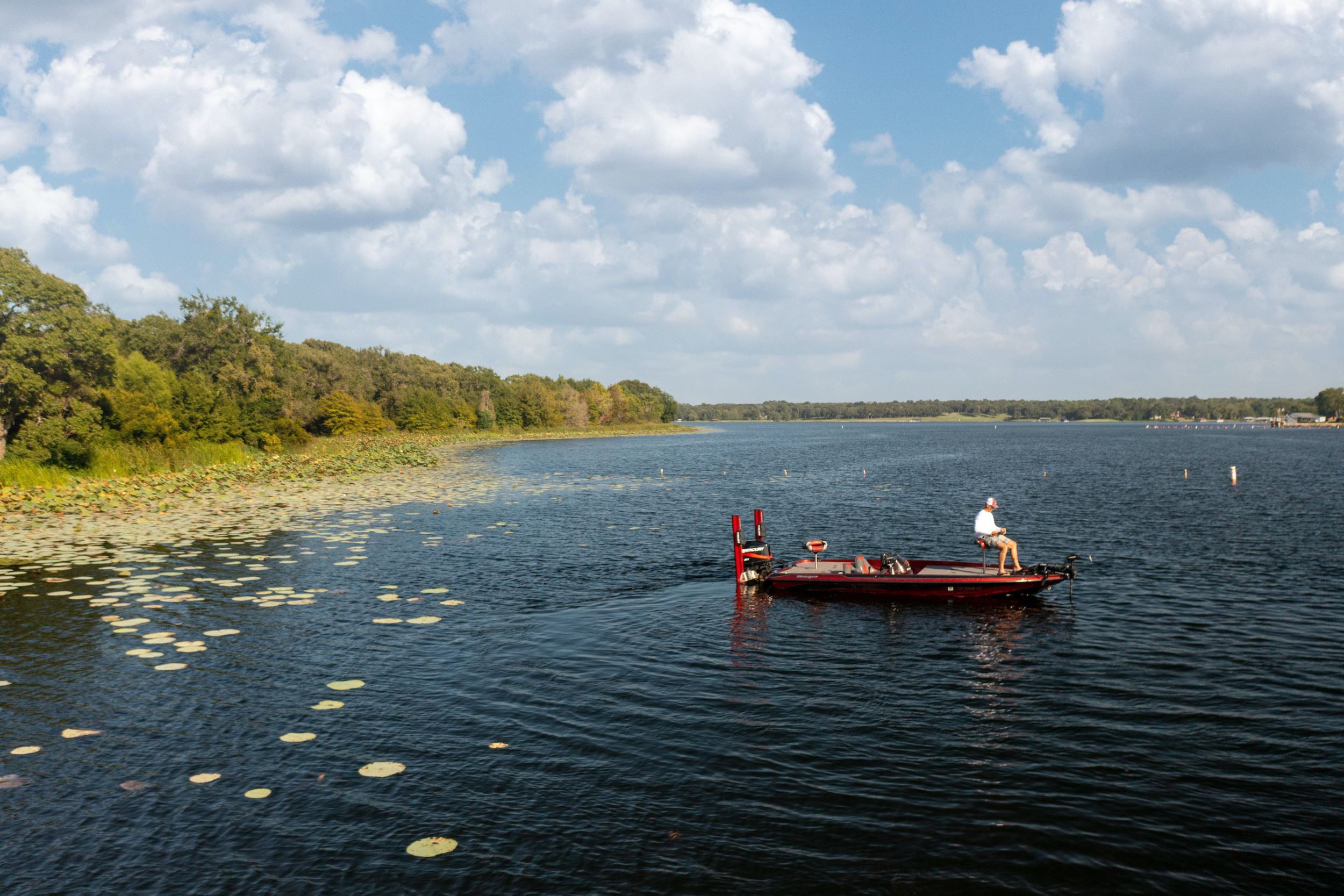 Side View of a Man on a Boat at Lake Athens